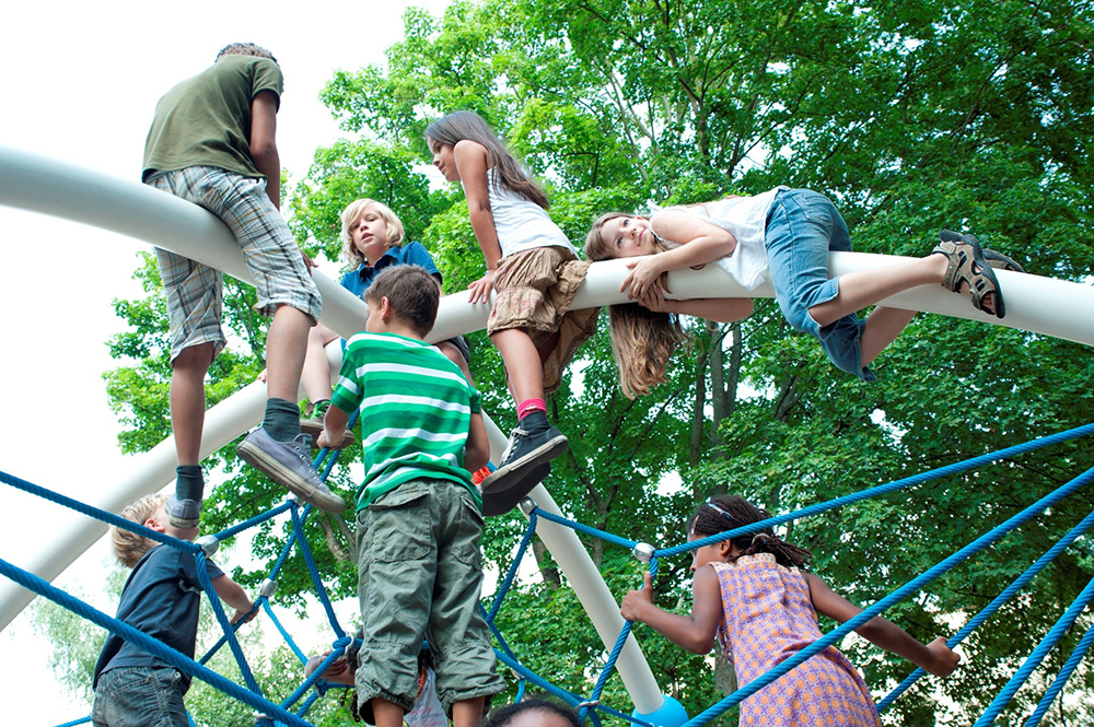 Children at the top of net climber
