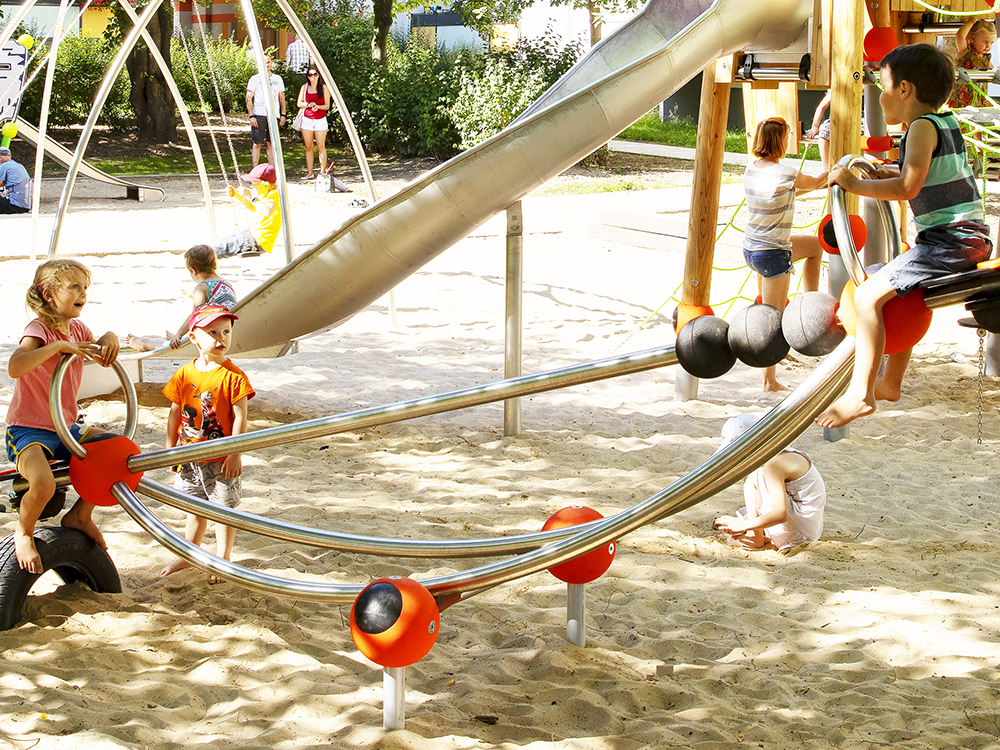 Children playing on stainless steel seesaw