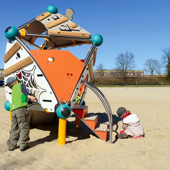 Children playing in sandpit with Spooky unit
