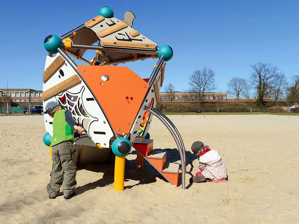 Children playing in sandpit with Spooky unit