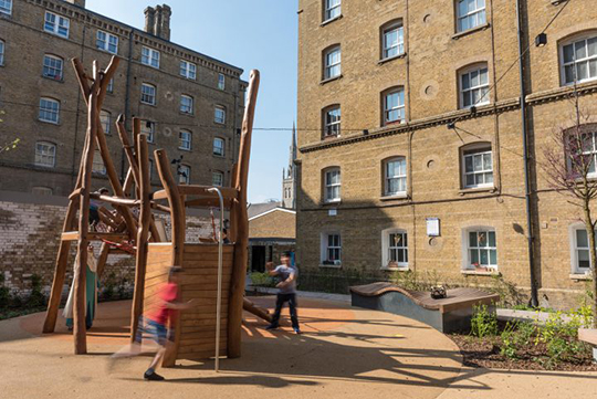Courtyard playground with timber climbing unit