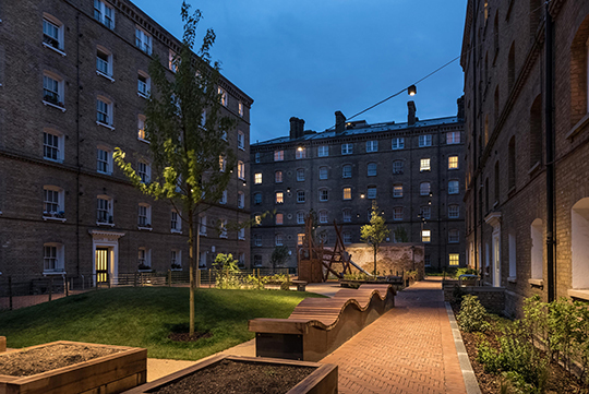 Shadwell Estate at night with benches and play structure