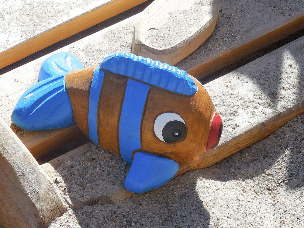 Timber fish themed sculpture