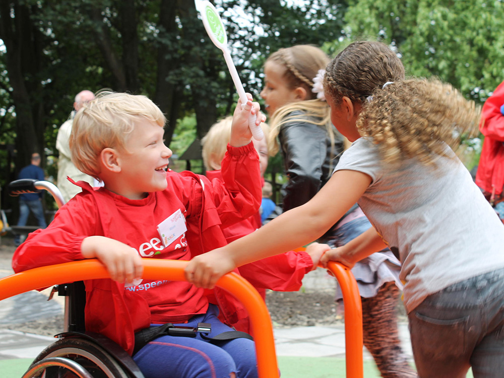 Children playing on inclusive Access Spinner
