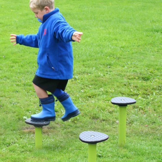Boy using wobble stepping posts